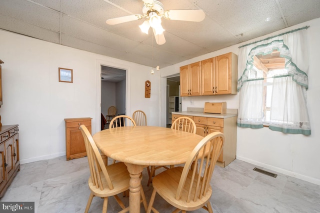 dining room with ceiling fan