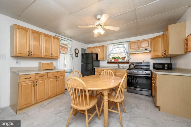 kitchen featuring ceiling fan, sink, plenty of natural light, and black appliances