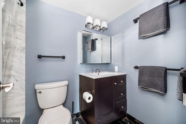 bathroom with vanity and toilet