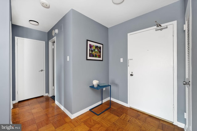 entrance foyer featuring parquet floors