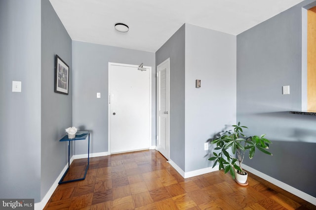 hallway with parquet flooring