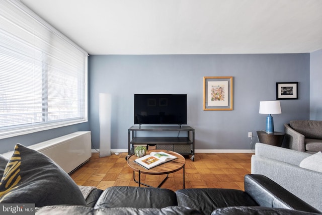 living room featuring light parquet flooring