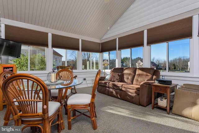 sunroom with vaulted ceiling and plenty of natural light