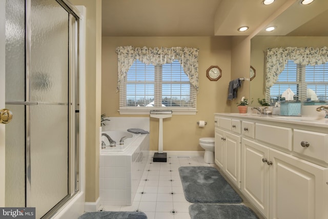 full bathroom featuring tile patterned floors, toilet, vanity, and shower with separate bathtub