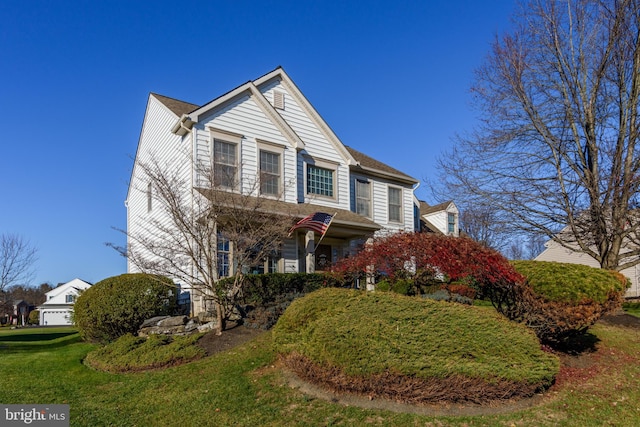 view of property featuring a front yard