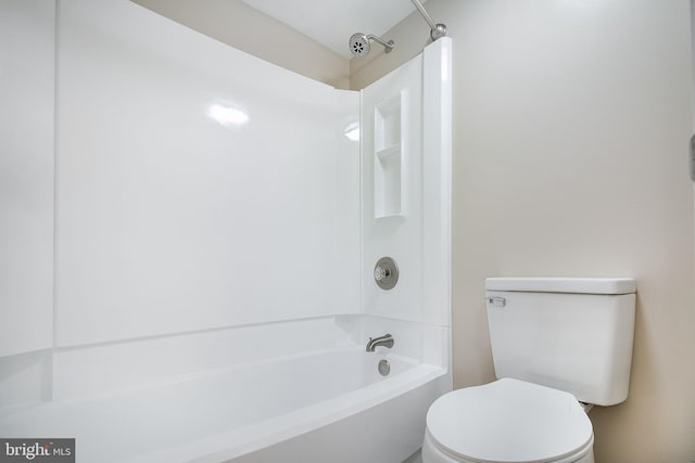 bathroom featuring toilet and shower / tub combination