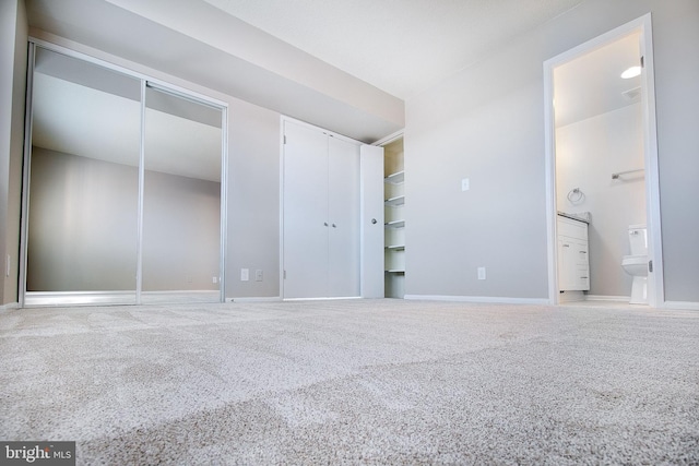 5901 Mount Eagle Dr Unit 1101, Alexandria, VA 22303 - unfurnished bedroom with carpet flooring, two closets, baseboards, and ensuite bathroom