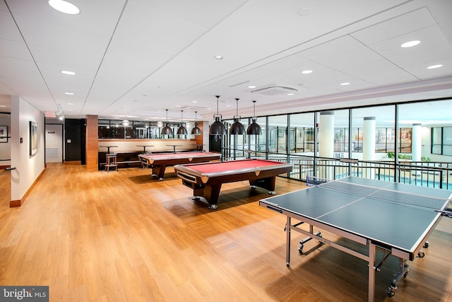 rec room with light hardwood / wood-style floors and pool table