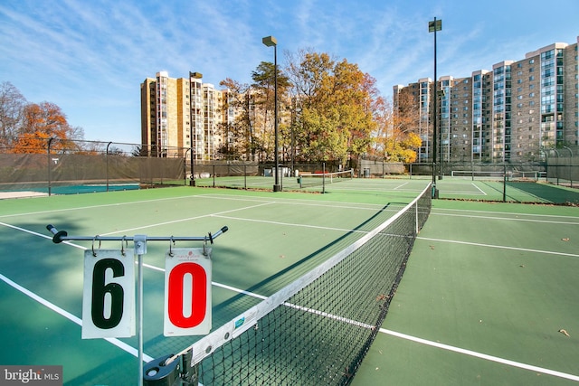 view of tennis court featuring basketball court