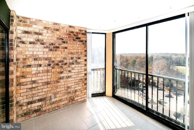 5901 Mount Eagle Dr Unit 1101, Alexandria, VA 22303 - tiled empty room featuring brick wall and expansive windows