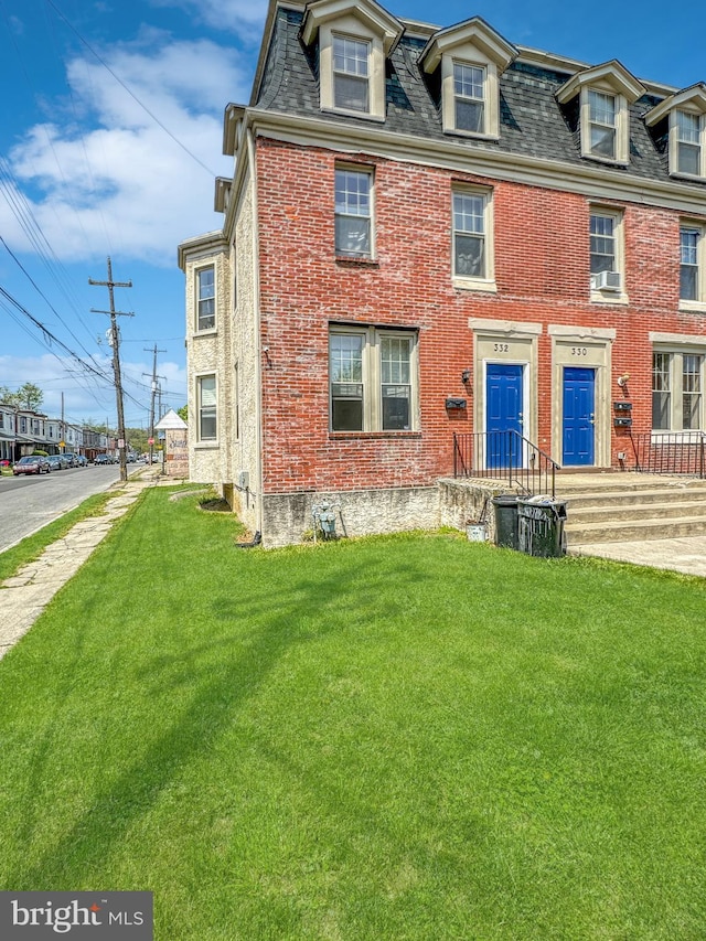 view of front of home with a front yard