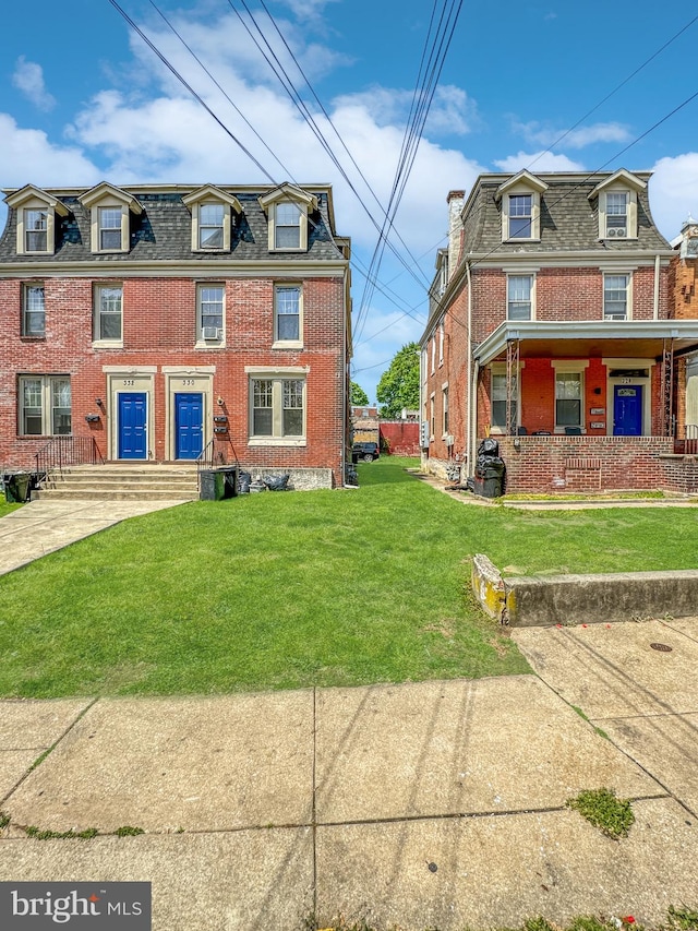 view of front of property with a front lawn