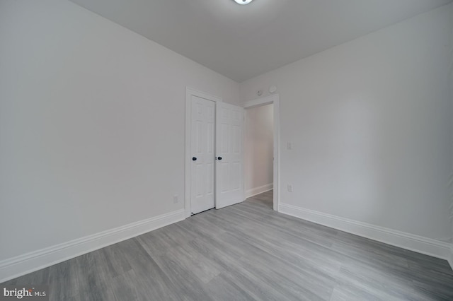 empty room with light hardwood / wood-style floors