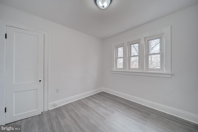 empty room with wood-type flooring