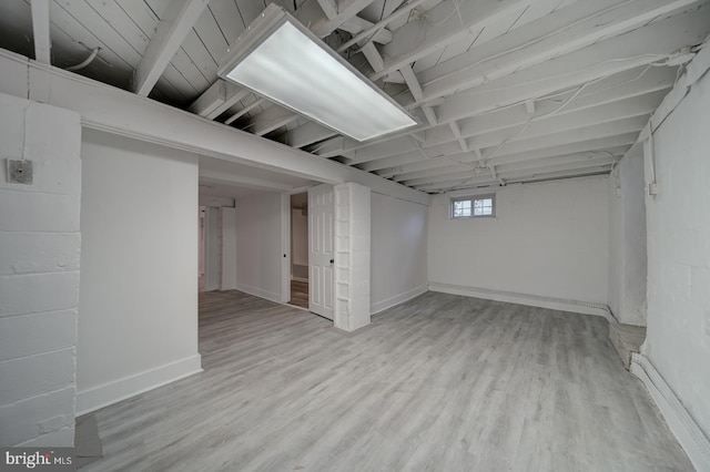 basement featuring light hardwood / wood-style floors