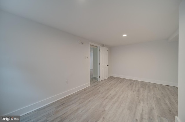 unfurnished room with light hardwood / wood-style floors