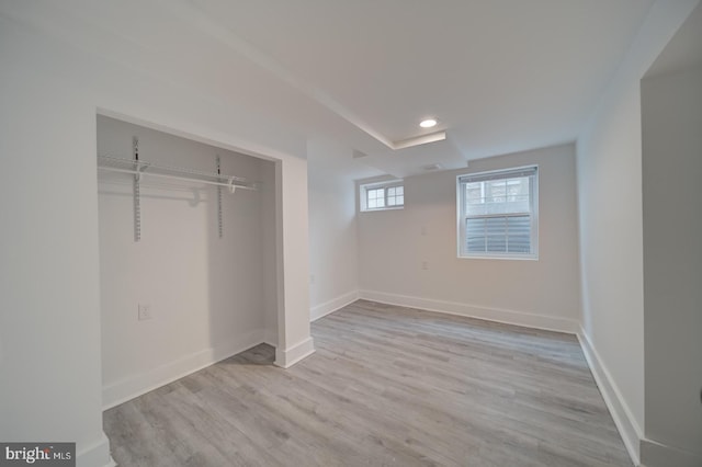 unfurnished bedroom featuring a closet and light hardwood / wood-style flooring