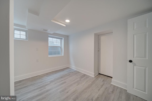 unfurnished room with light wood-type flooring