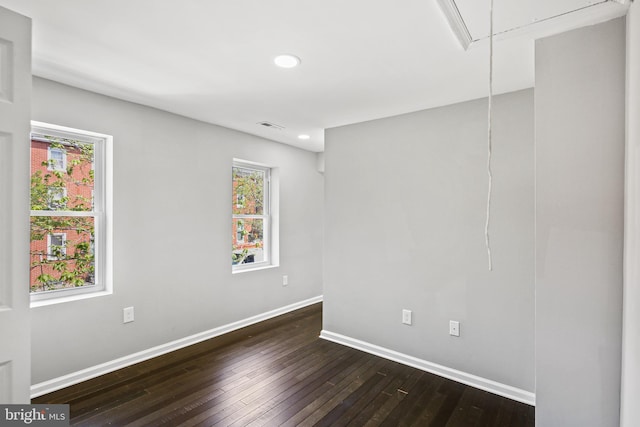 empty room featuring dark hardwood / wood-style floors