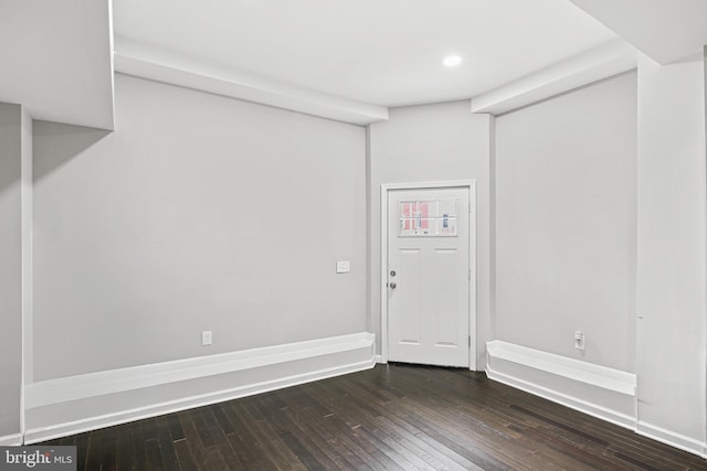 spare room featuring dark hardwood / wood-style floors