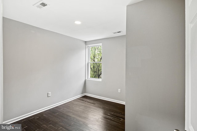 unfurnished room featuring dark hardwood / wood-style floors