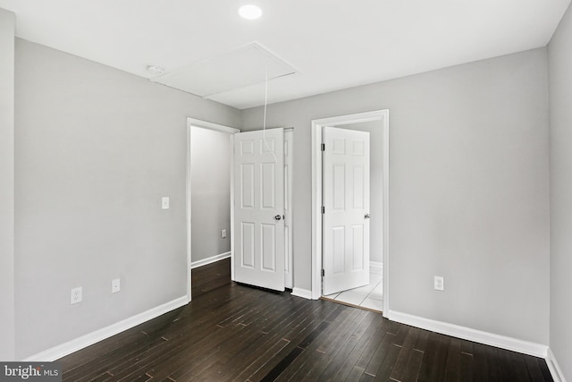 unfurnished bedroom featuring dark wood-type flooring