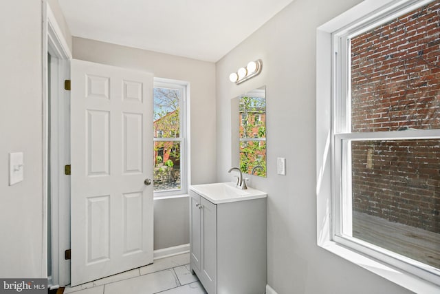 bathroom with tile patterned flooring and vanity