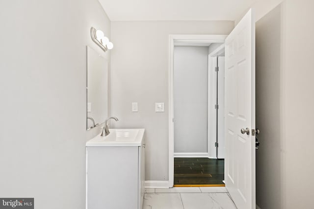 bathroom with vanity and wood-type flooring