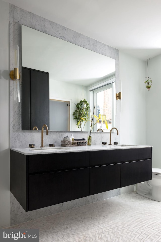 kitchen featuring decorative backsplash and sink