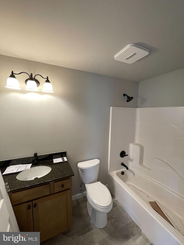 bathroom with toilet, bathing tub / shower combination, and vanity