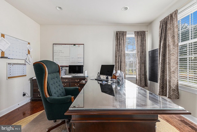 office space with hardwood / wood-style flooring