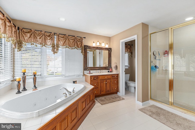 full bathroom with tile patterned flooring, vanity, toilet, and independent shower and bath