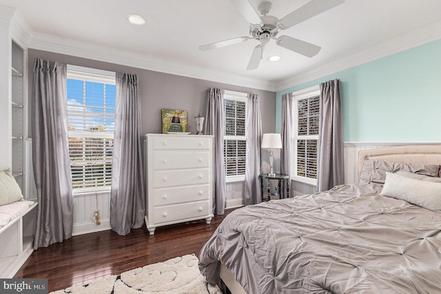 bedroom with crown molding, ceiling fan, and dark wood-type flooring