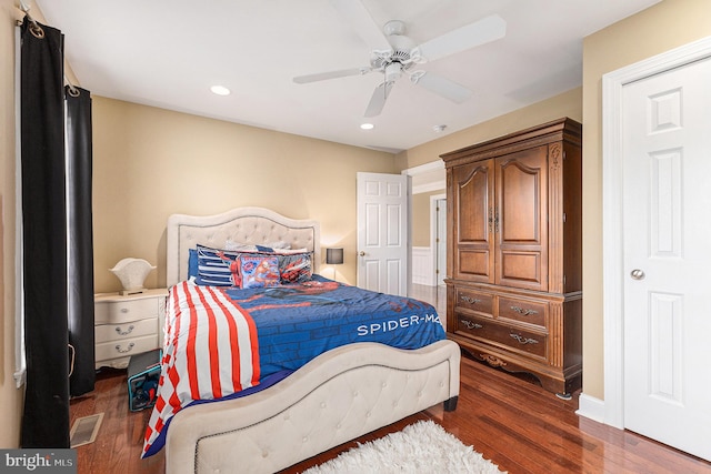 bedroom featuring dark hardwood / wood-style flooring and ceiling fan