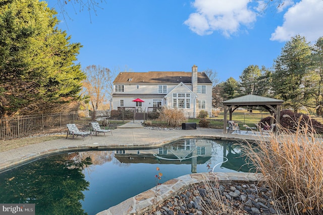 view of swimming pool with a gazebo and a patio