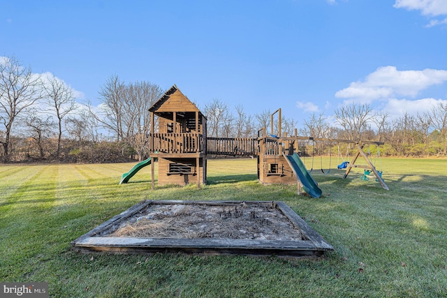 view of jungle gym featuring a lawn