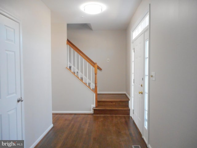 foyer featuring dark hardwood / wood-style floors