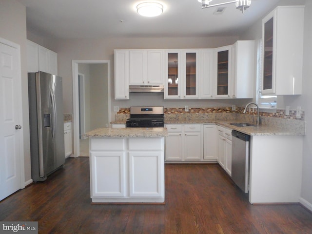 kitchen featuring dark hardwood / wood-style floors, sink, white cabinets, light stone counters, and stainless steel appliances