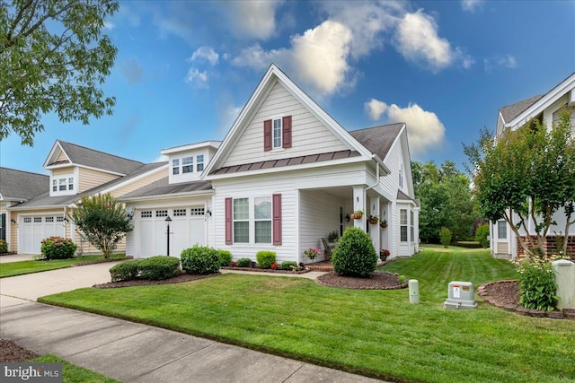 view of front of property featuring a front lawn and a garage