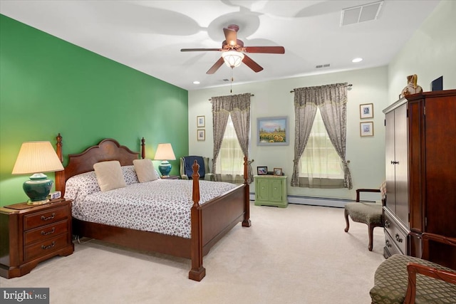 carpeted bedroom featuring ceiling fan and a baseboard heating unit