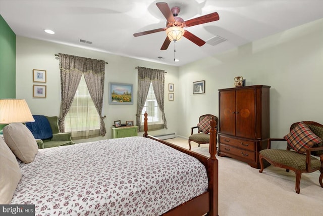 carpeted bedroom featuring a baseboard radiator and ceiling fan