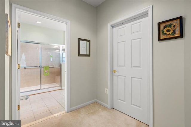 entryway featuring light carpet