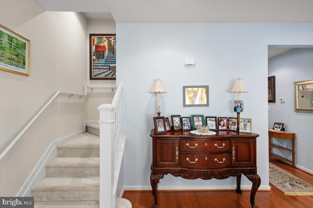 staircase featuring hardwood / wood-style flooring