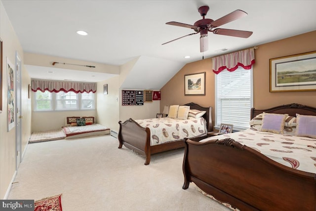 bedroom featuring multiple windows, ceiling fan, and light carpet