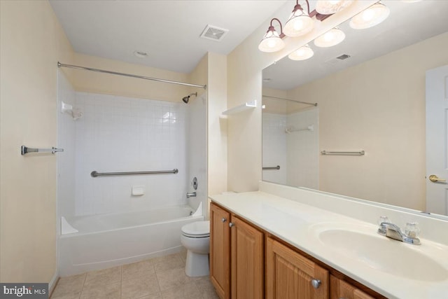 full bathroom featuring tile patterned flooring, vanity, toilet, and tiled shower / bath combo