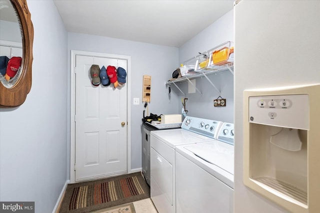 laundry room featuring washing machine and dryer