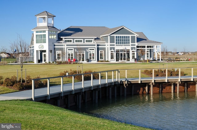 dock area featuring a yard and a water view