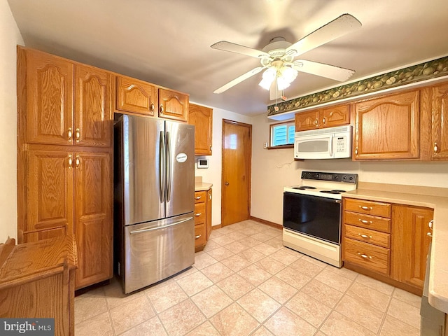 kitchen featuring ceiling fan and white appliances