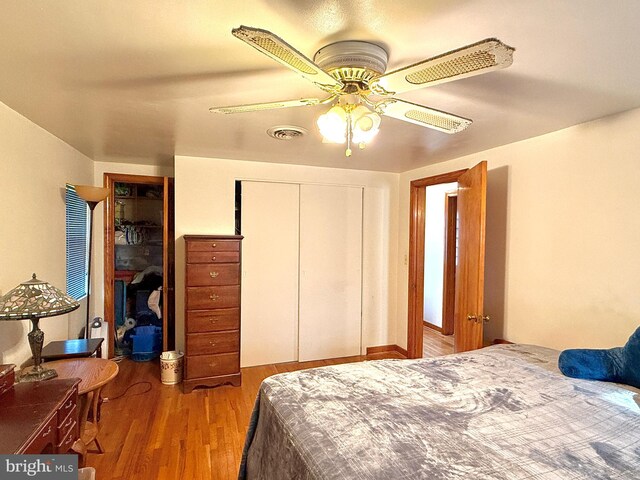 bedroom with hardwood / wood-style flooring and ceiling fan