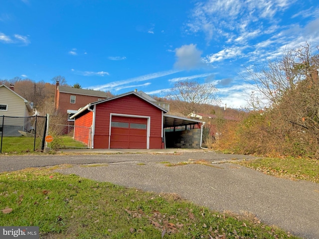 garage featuring a carport